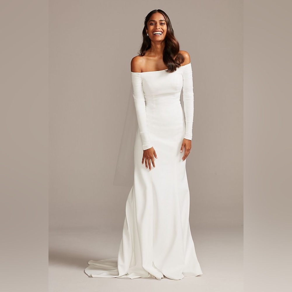 off the shoulder wedding dress/buttons down the back and extended train.